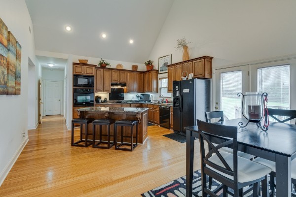 4664 New Cut Road Greenbrier, TN 37073 - Photo 9 of 85 a kitchen with a table chairs and a refrigerator