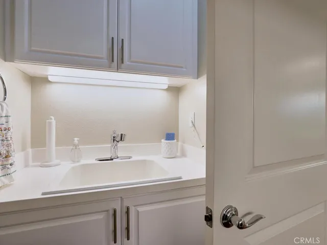 a bathroom with a double vanity sink a mirror and shower