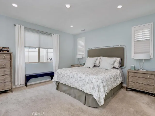 a view of a hallway with closet and bathroom