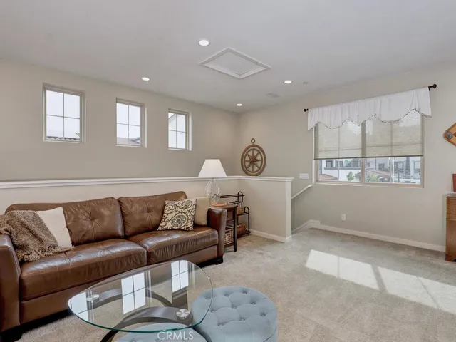 a front view of a house with a garden and trees