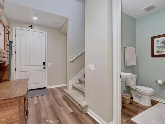 a bathroom with a toilet a sink and a mirror