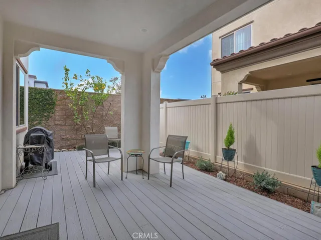 a view of swimming pool with outdoor seating and city view