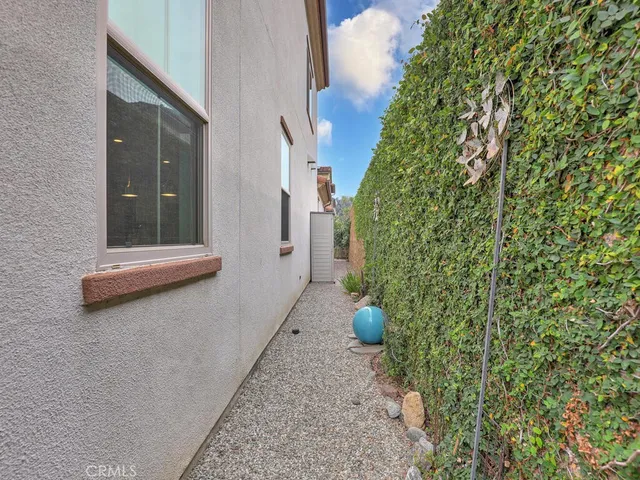 a view of a patio with couches table and chairs and potted plants