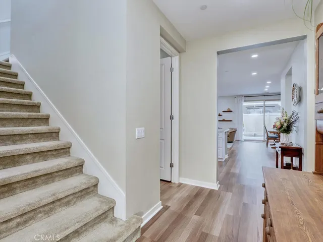 a kitchen with stainless steel appliances granite countertop a kitchen island a stove a table and chairs in it