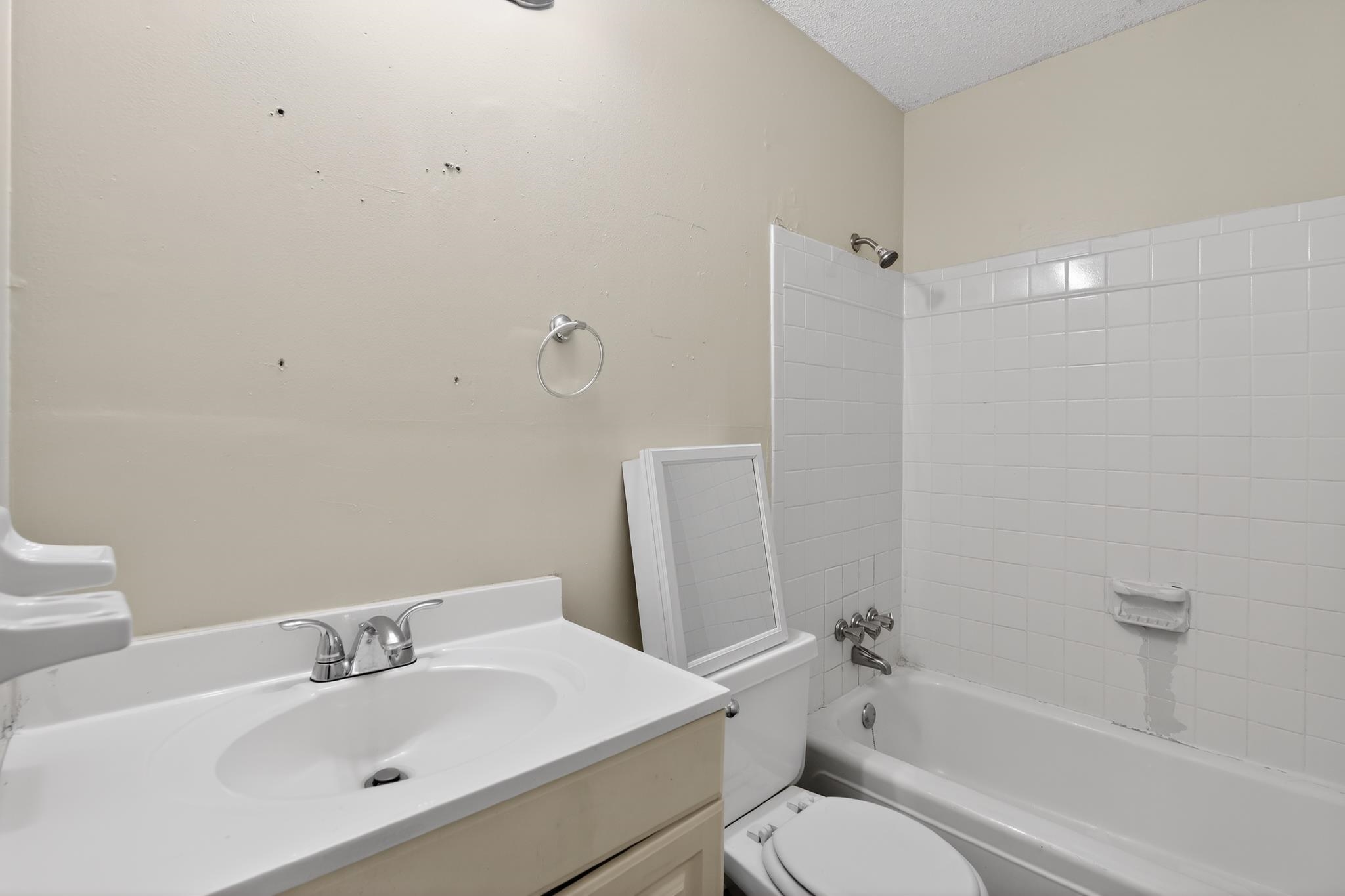 2015 East Holmes Road Memphis, TN 38116 - Photo 31 of 34 a bathroom with a sink toilet and shower
