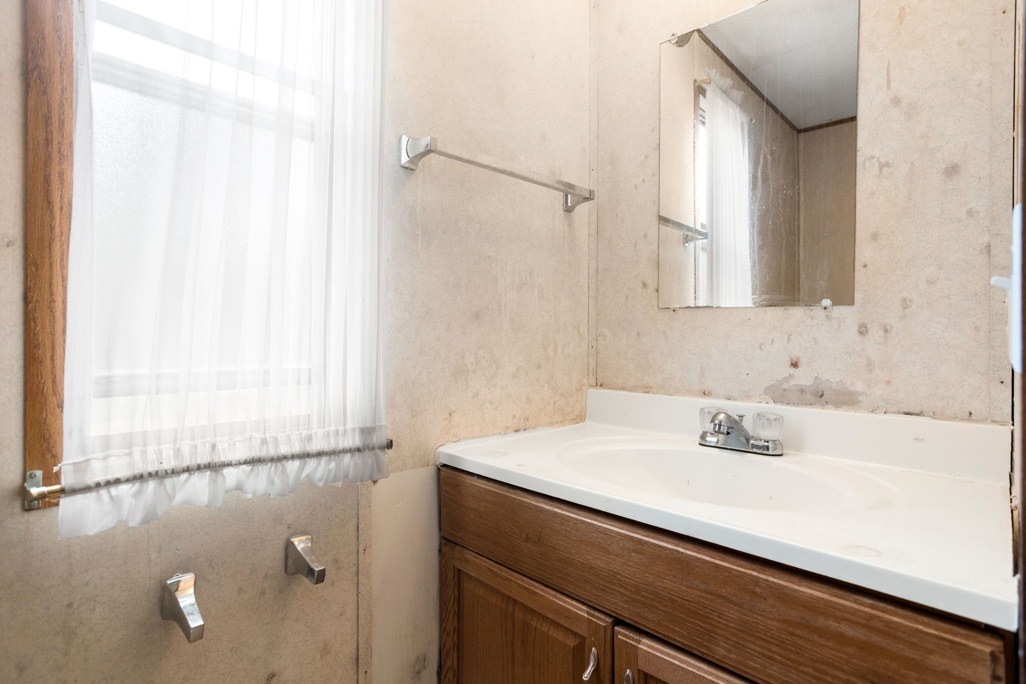 7075 Whartons Dock Road Bandera, TX 78003 - Photo 12 of 19 a bathroom with a sink and a mirror