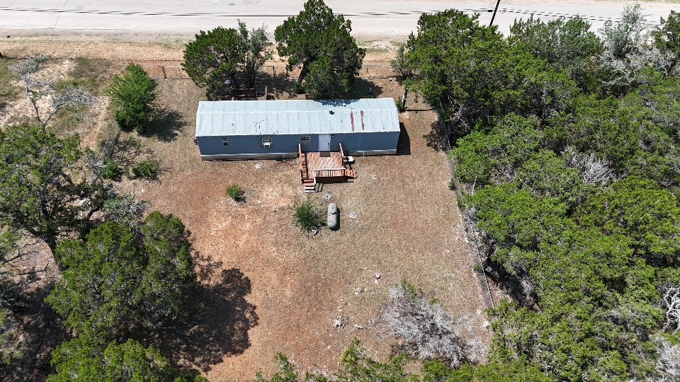 7075 Whartons Dock Road Bandera, TX 78003 - Photo 17 of 19 an aerial view of a house with yard and lake view