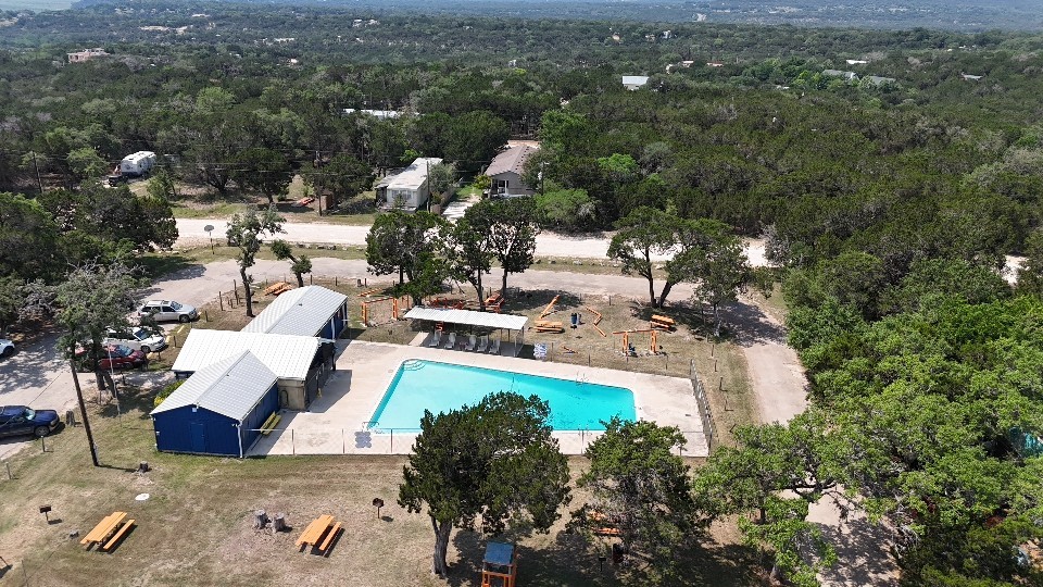 7075 Whartons Dock Road Bandera, TX 78003 - Photo 19 of 19 a view of a house with pool and sitting area