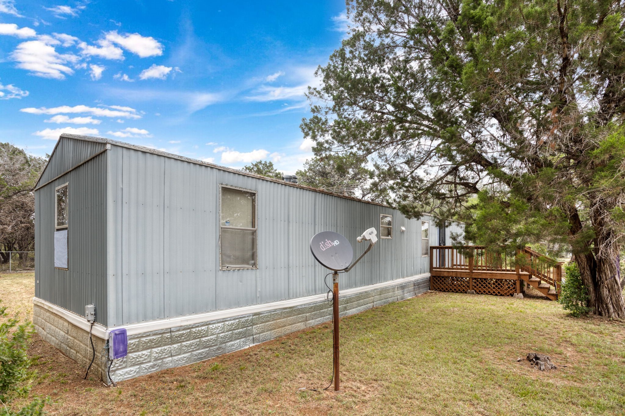 7075 Whartons Dock Road Bandera, TX 78003 - Photo 3 of 19 a backyard of a house