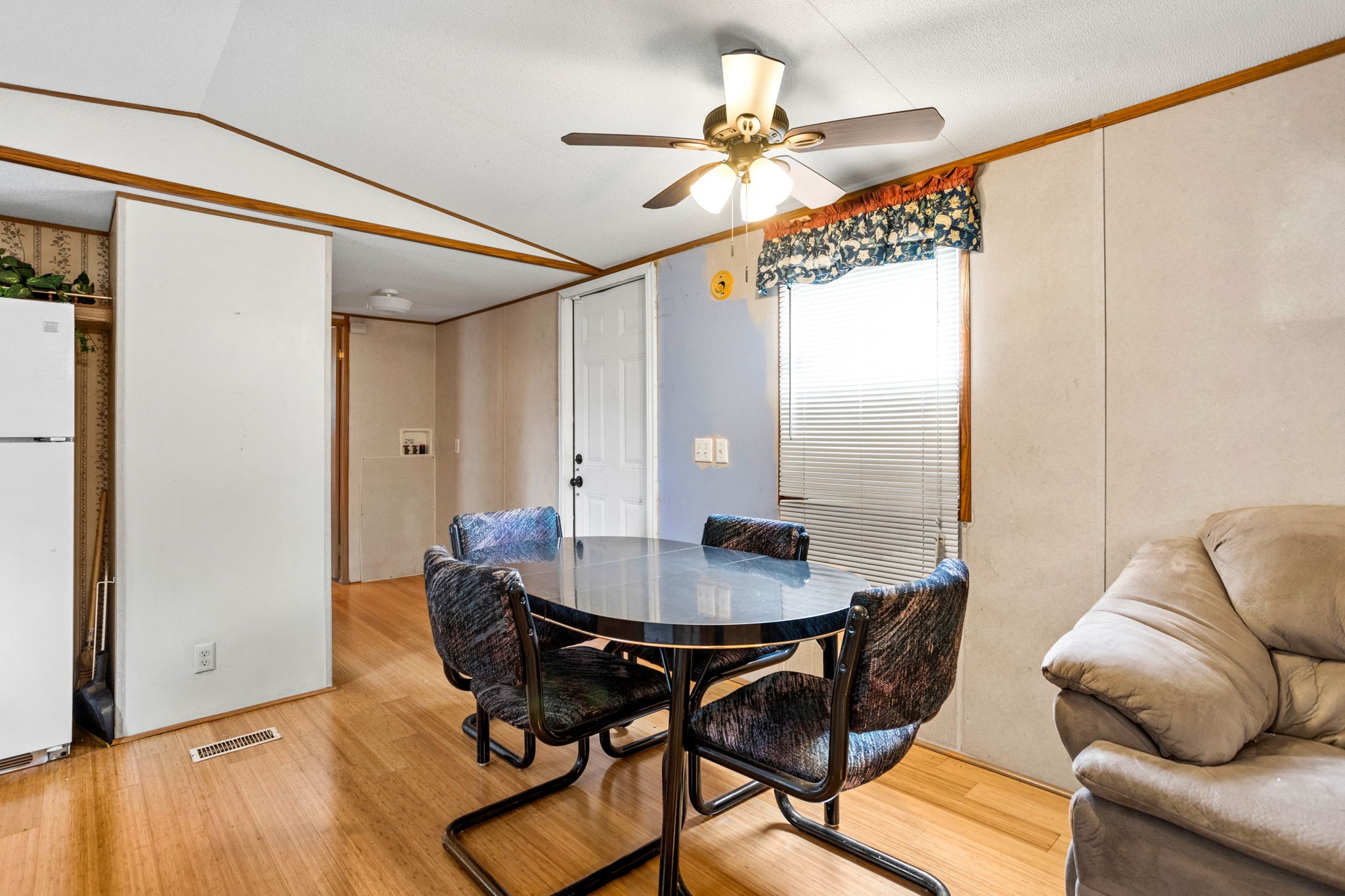 7075 Whartons Dock Road Bandera, TX 78003 - Photo 6 of 19 a view of a dining room with furniture and a chandelier