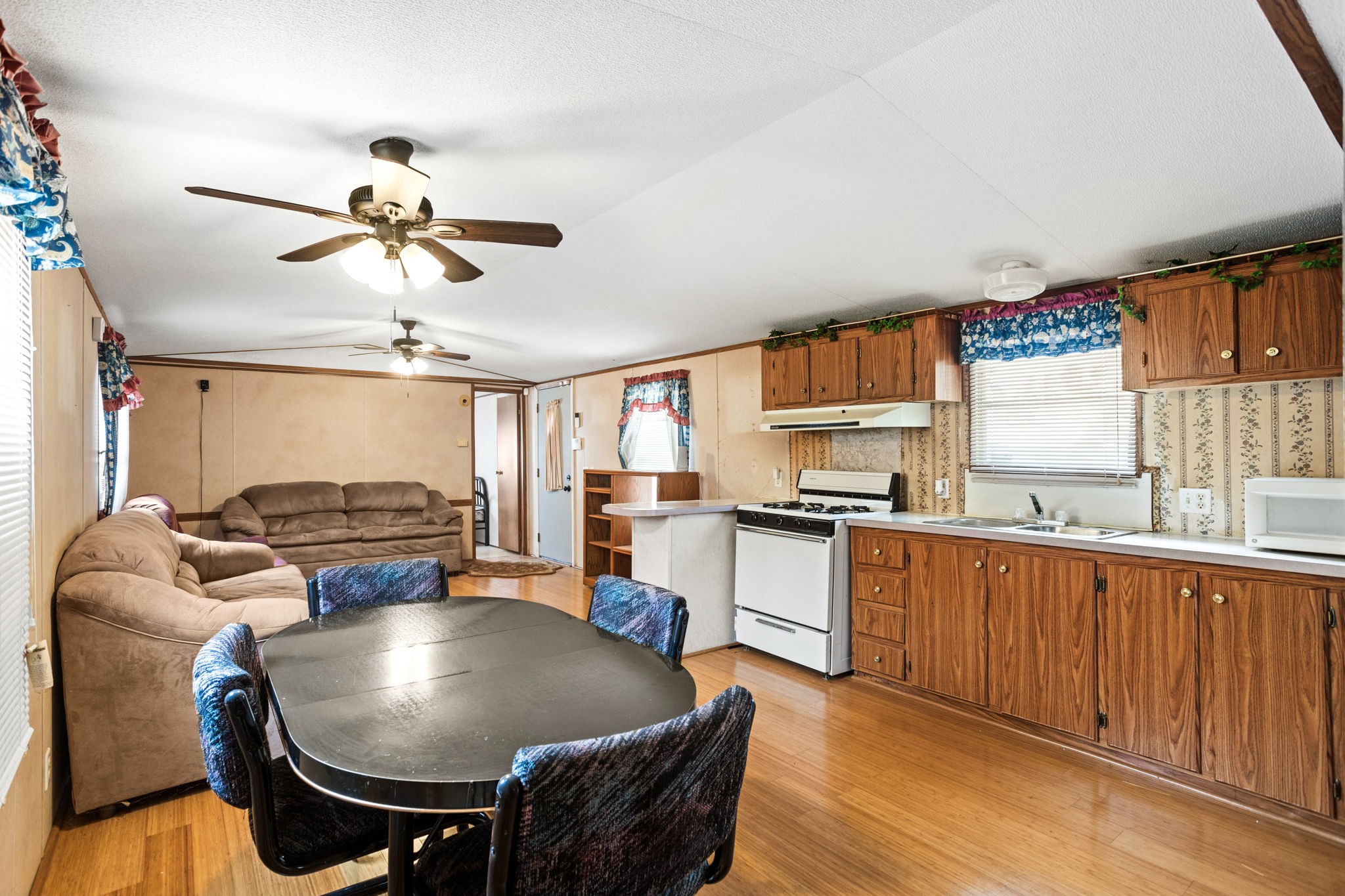 7075 Whartons Dock Road Bandera, TX 78003 - Photo 8 of 19 a living room with kitchen island furniture and a window