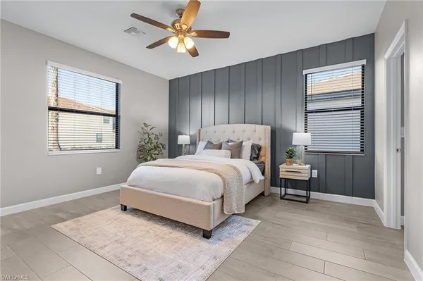 a bedroom with a large bed and a window