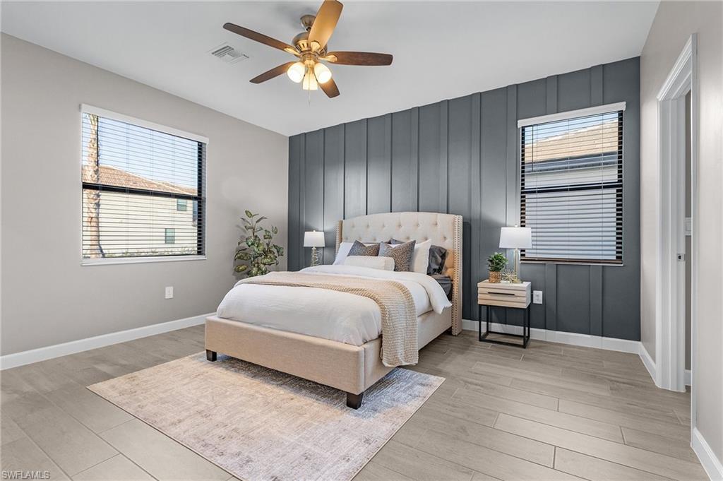 20716 Napa Loop Estero, FL 33928 - Photo 12 of 50 a bedroom with a large bed and a window