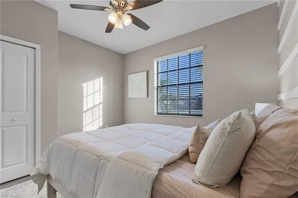 a bedroom with a bed and window