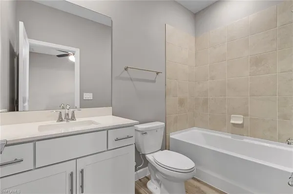 a bathroom with a sink a toilet and a bathtub