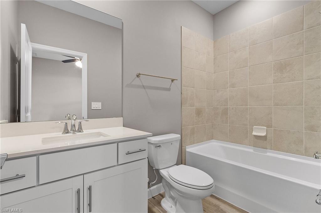 20716 Napa Loop Estero, FL 33928 - Photo 20 of 50 a bathroom with a sink a toilet and a bathtub