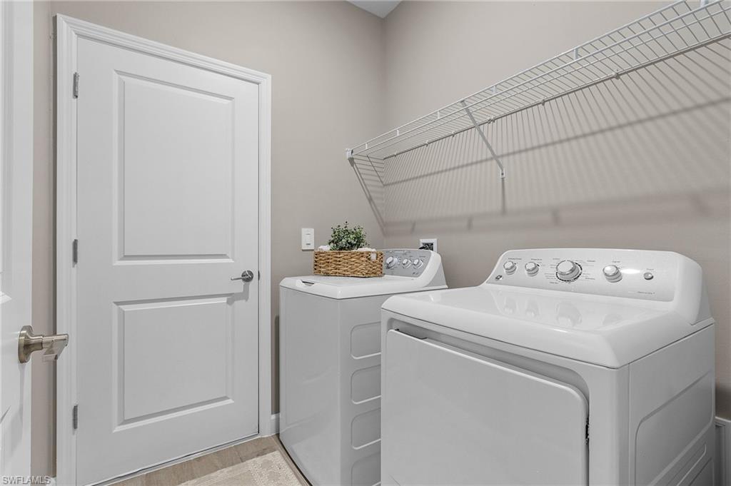 20716 Napa Loop Estero, FL 33928 - Photo 21 of 50 a utility room with dryer and washer