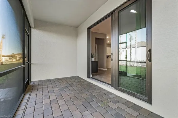 a view of a glass door and an empty room