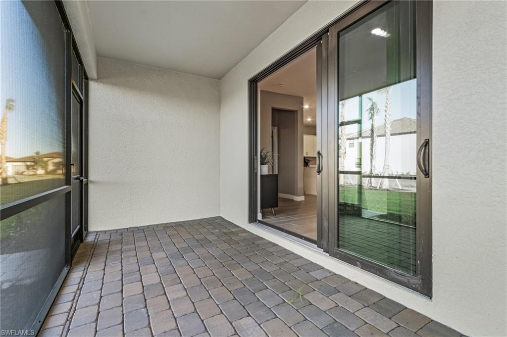 20716 Napa Loop Estero, FL 33928 - Photo 22 of 50 a view of a glass door and an empty room