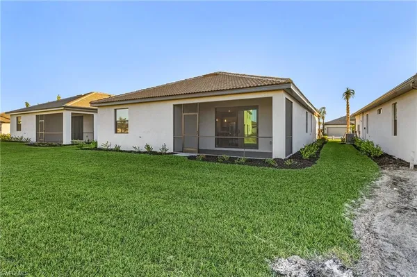 a front view of house with yard and green space