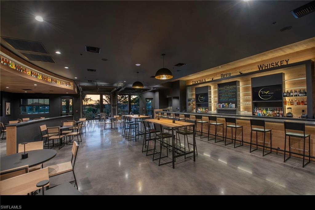 20716 Napa Loop Estero, FL 33928 - Photo 30 of 50 a view of a dining room with furniture