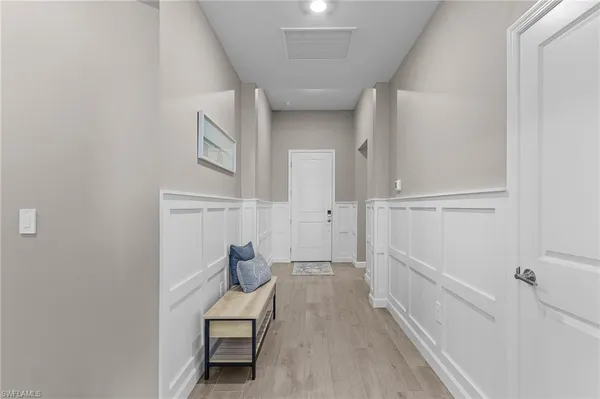 a view of a hallway with seating area