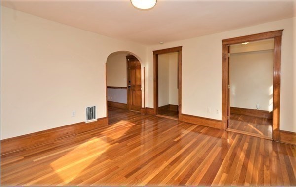 24 Elm Street Boston, MA 02136 - Photo 14 of 27 a view of empty room with wooden floor