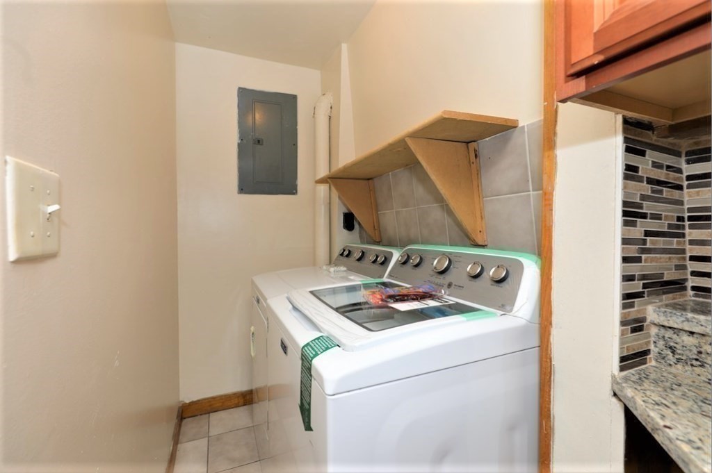 24 Elm Street Boston, MA 02136 - Photo 16 of 27 a bathroom with a sink and a mirror