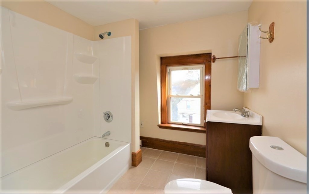 24 Elm Street Boston, MA 02136 - Photo 8 of 27 a bathroom with a bathtub toilet and sink