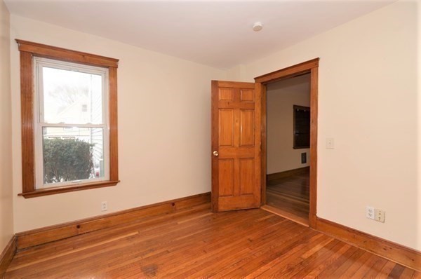 24 Elm Street Boston, MA 02136 - Photo 10 of 27 an empty room with windows and closet