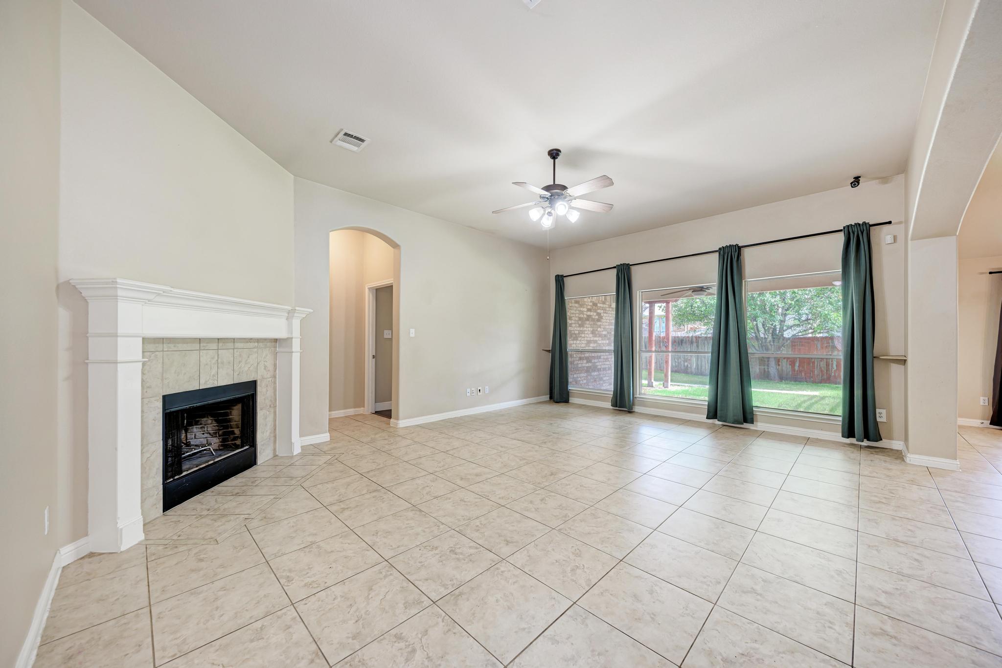 18308 Shallow Pool Drive Pflugerville, TX 78660 - Photo 9 of 40 NO carpet in the home! New curtains in the living room.
