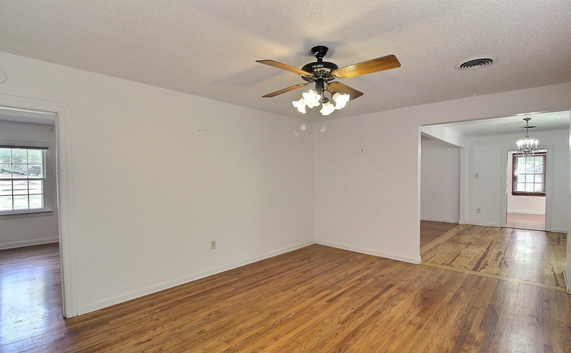 487 South Center Street Collierville, TN 38017 - Photo 14 of 25 a view of an empty room with wooden floor and a window