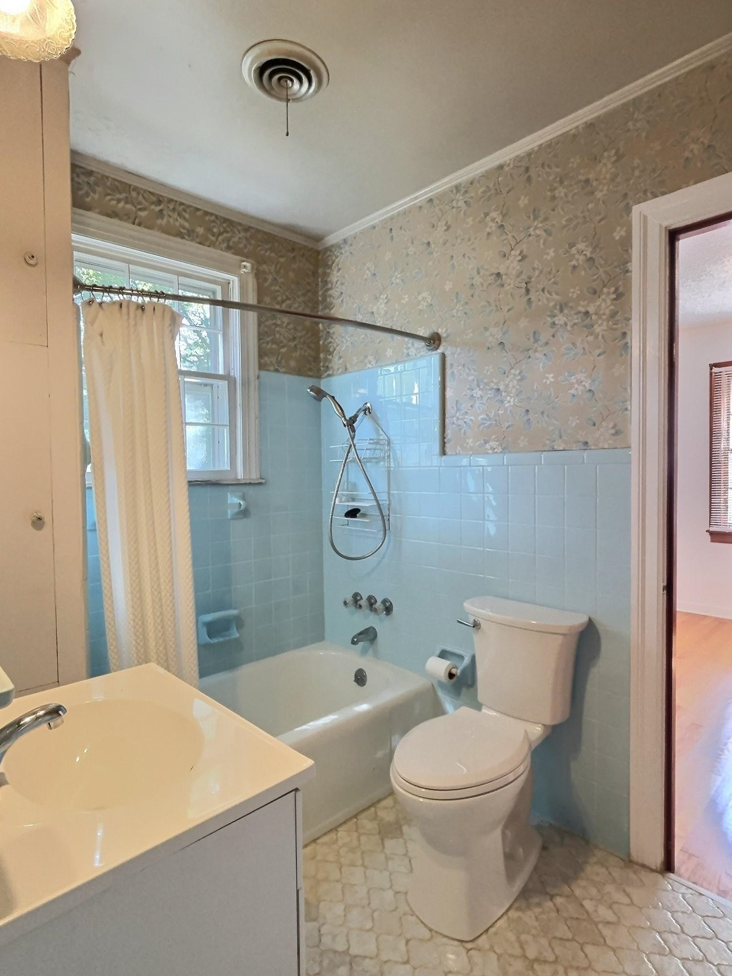 487 South Center Street Collierville, TN 38017 - Photo 20 of 25 a bathroom with a toilet a sink and a shower