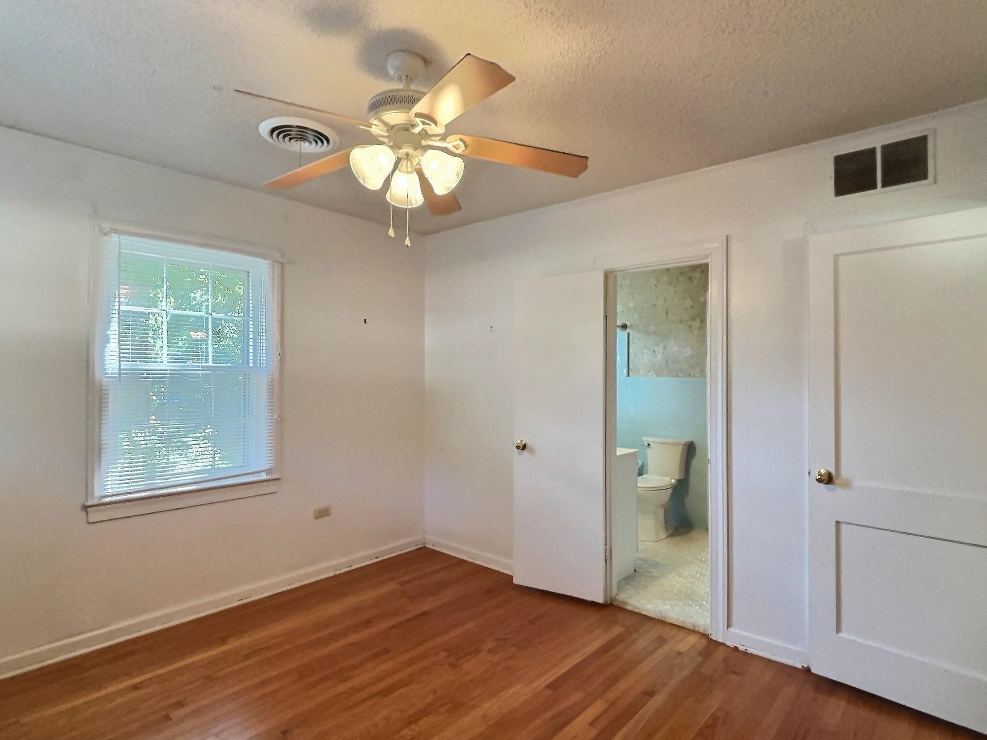 487 South Center Street Collierville, TN 38017 - Photo 21 of 25 wooden floor in an empty room with a window