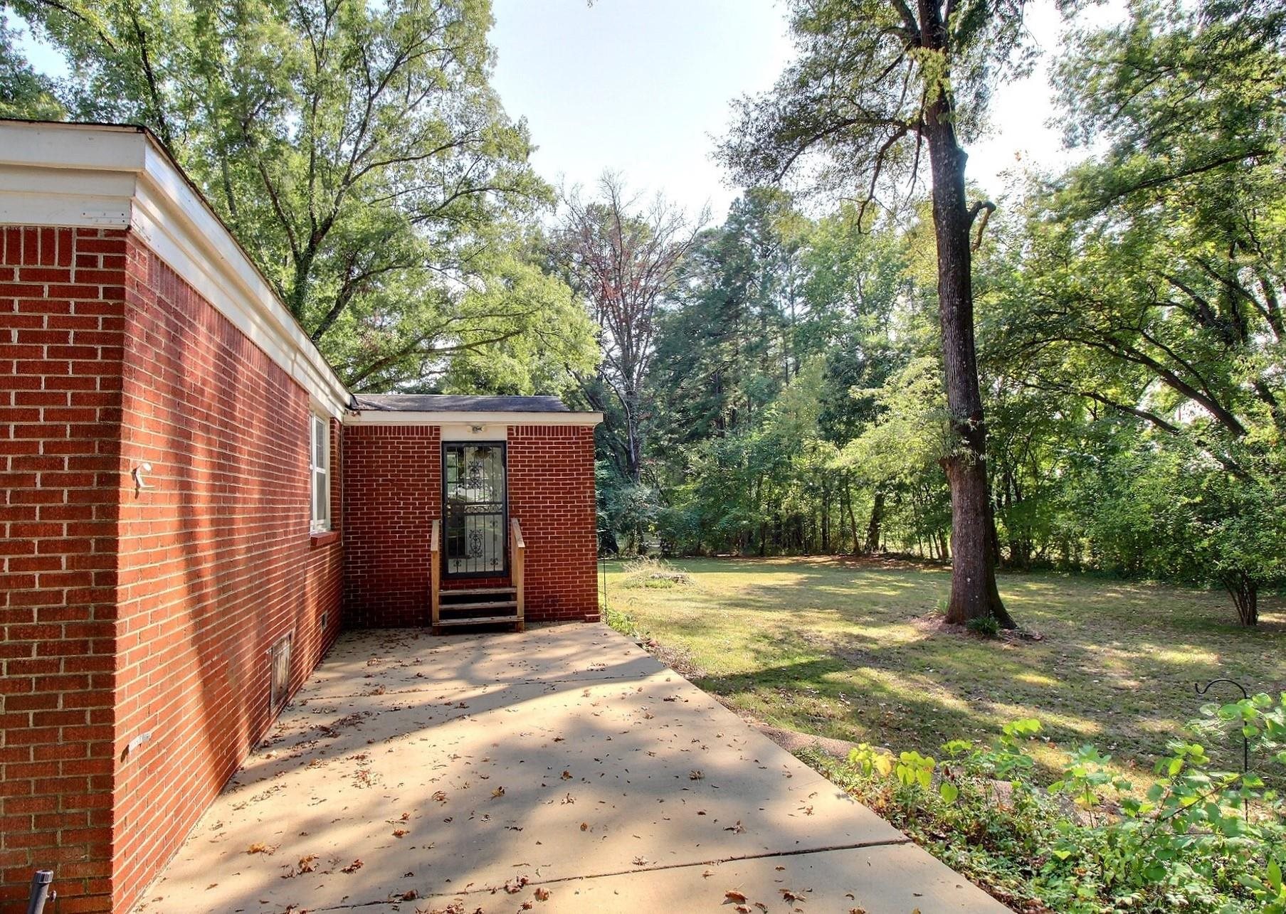 487 South Center Street Collierville, TN 38017 - Photo 24 of 25 a view of a house with a yard