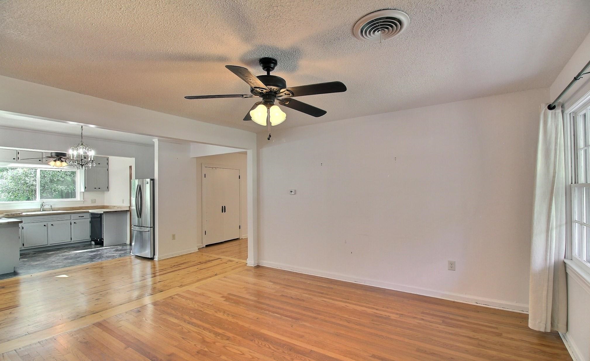 487 South Center Street Collierville, TN 38017 - Photo 7 of 25 wooden floor in an empty room with a window