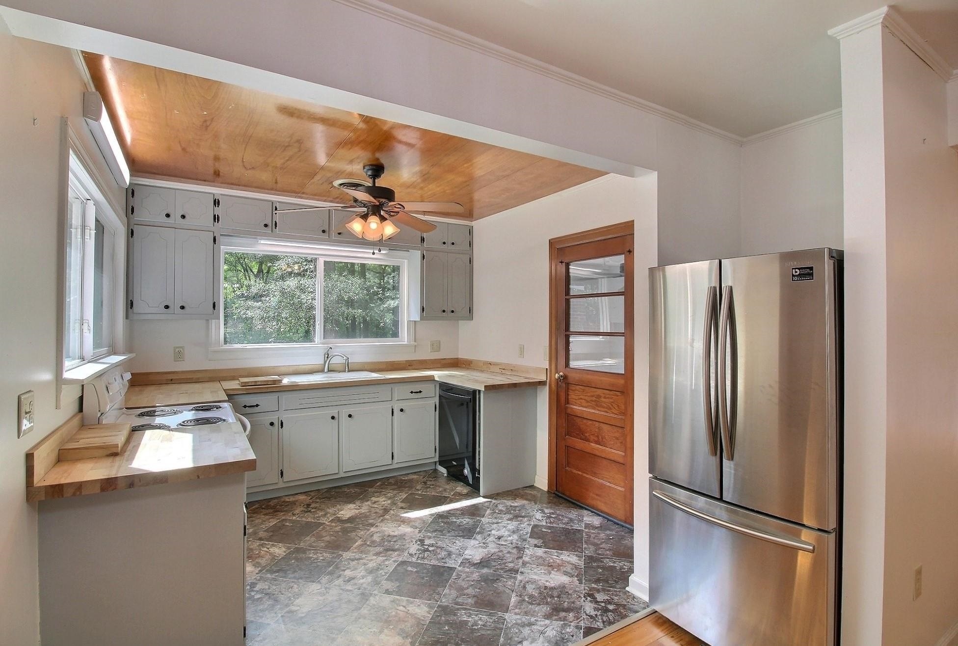 487 South Center Street Collierville, TN 38017 - Photo 8 of 25 a kitchen with stainless steel appliances granite countertop a refrigerator and a sink
