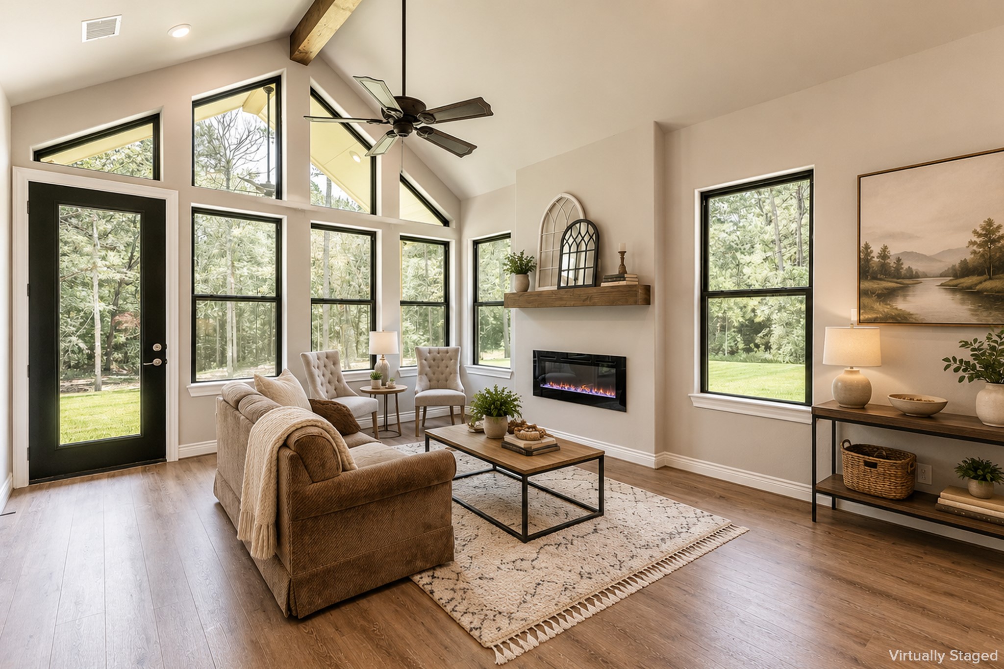 111 Eagle Run Road Willis, TX 77378 - Photo 34 of 44 Electric fireplace, vinyl plank flooring and door leading to its own covered back porch