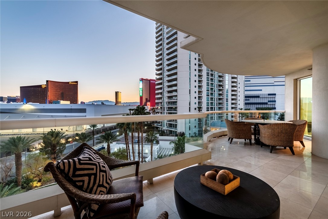 2857 Paradise Road, Unit 602 Las Vegas, NV 89109 - Photo 13 of 33 A spacious tiled balcony frames sweeping city skyline views.