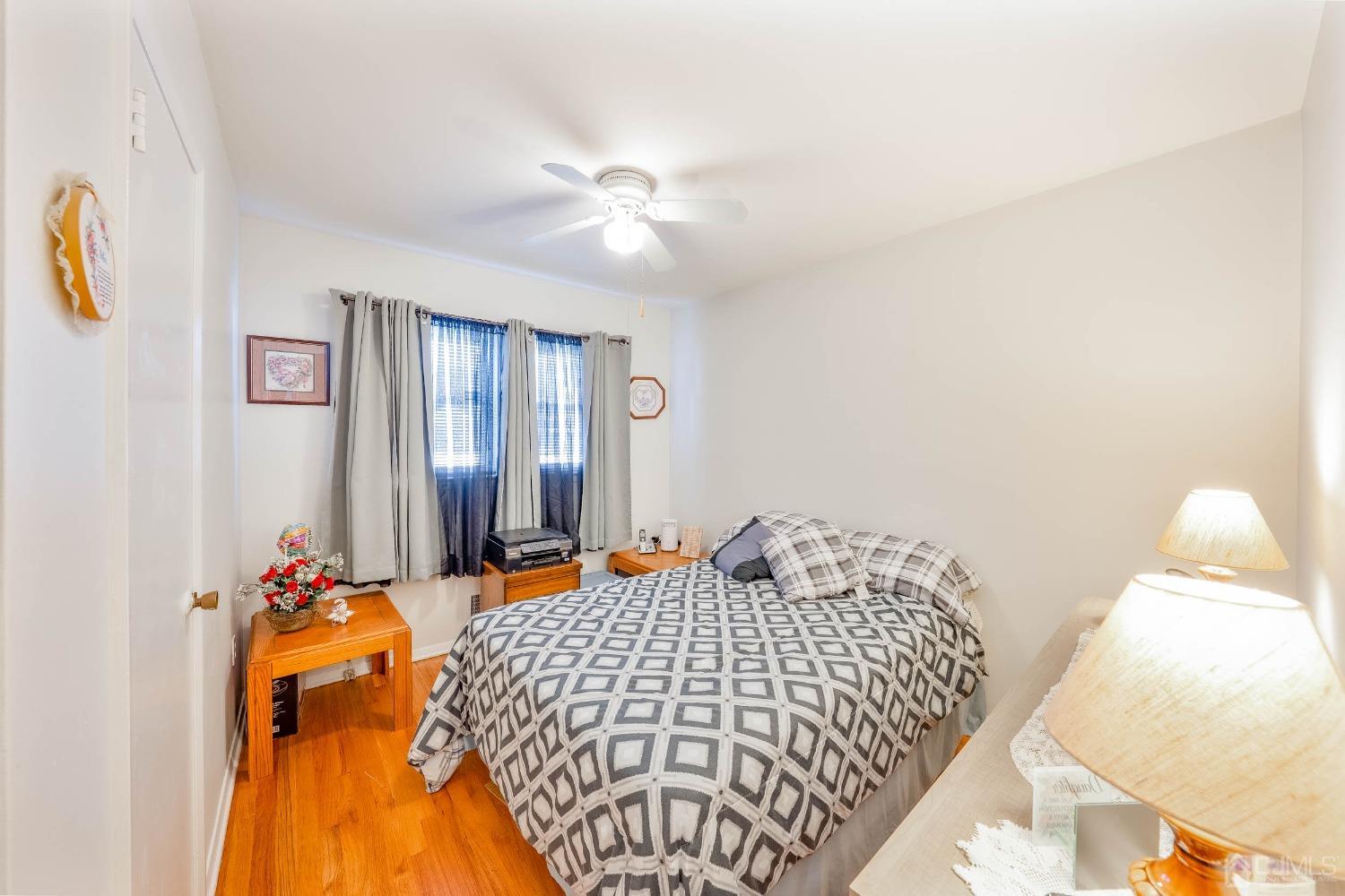 5 Mercer Road Old Bridge, NJ 08857 - Photo 14 of 27 a bedroom with a bed and a chandelier
