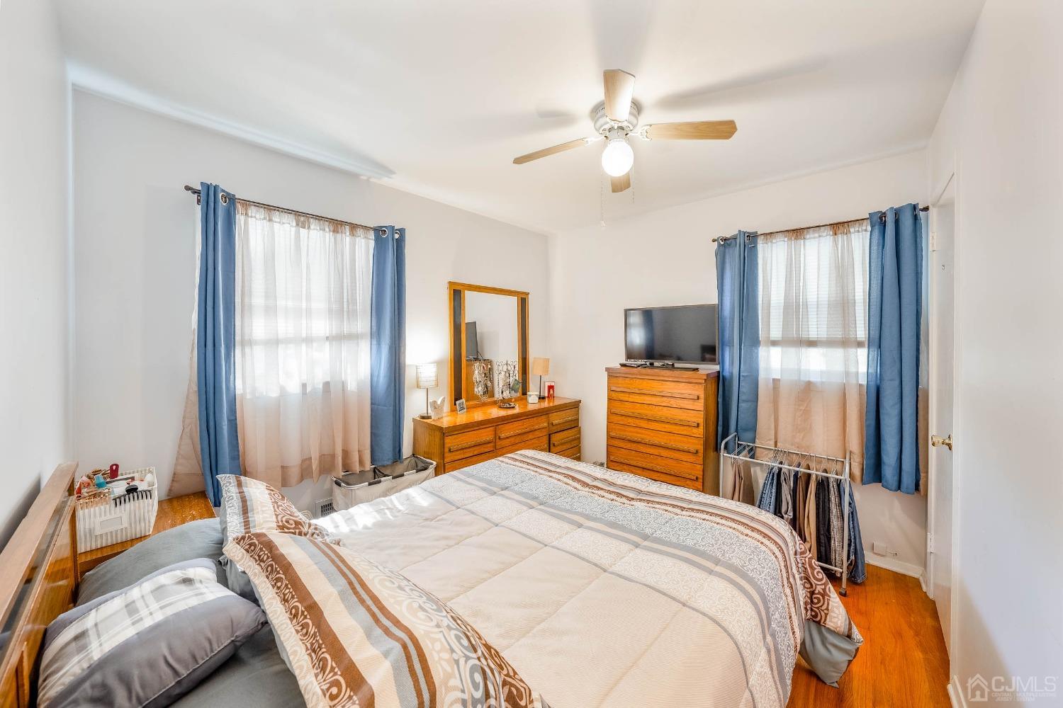 5 Mercer Road Old Bridge, NJ 08857 - Photo 16 of 27 a bedroom with a bed and wooden floor
