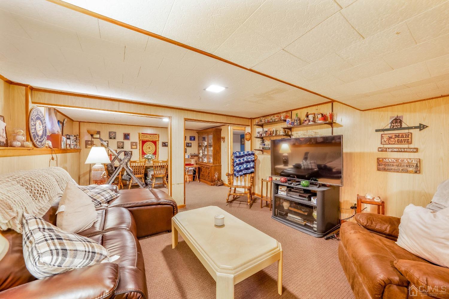 5 Mercer Road Old Bridge, NJ 08857 - Photo 20 of 27 a living room with furniture a flat screen tv and outdoor view