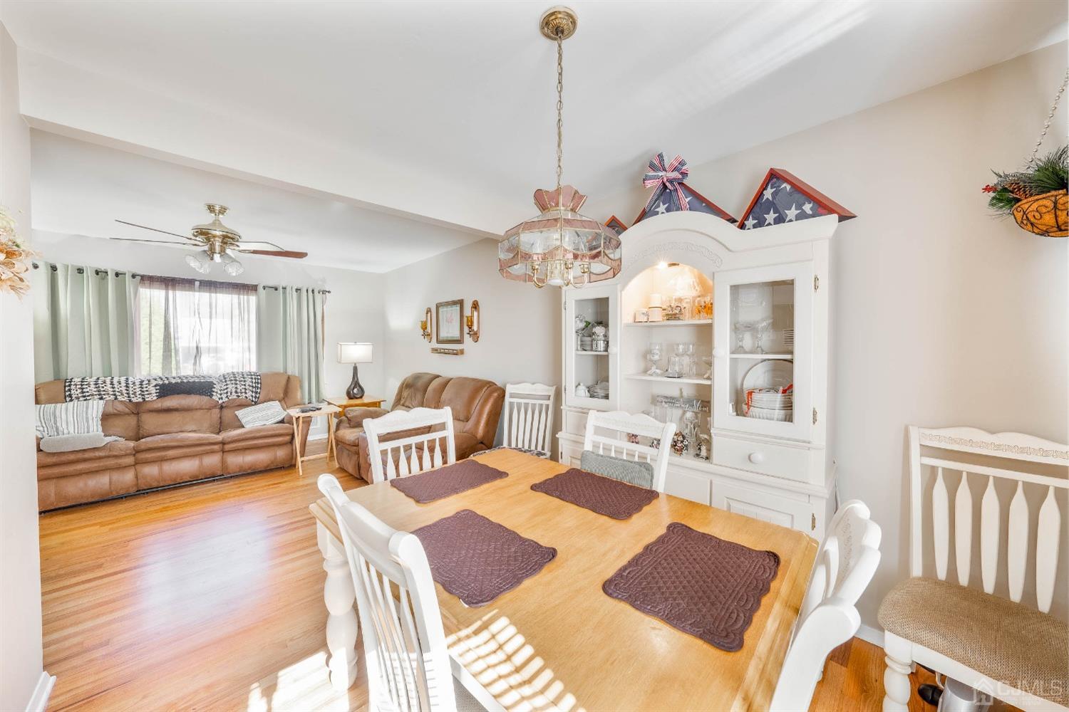 5 Mercer Road Old Bridge, NJ 08857 - Photo 8 of 27 a living room with furniture dining table and a chandelier