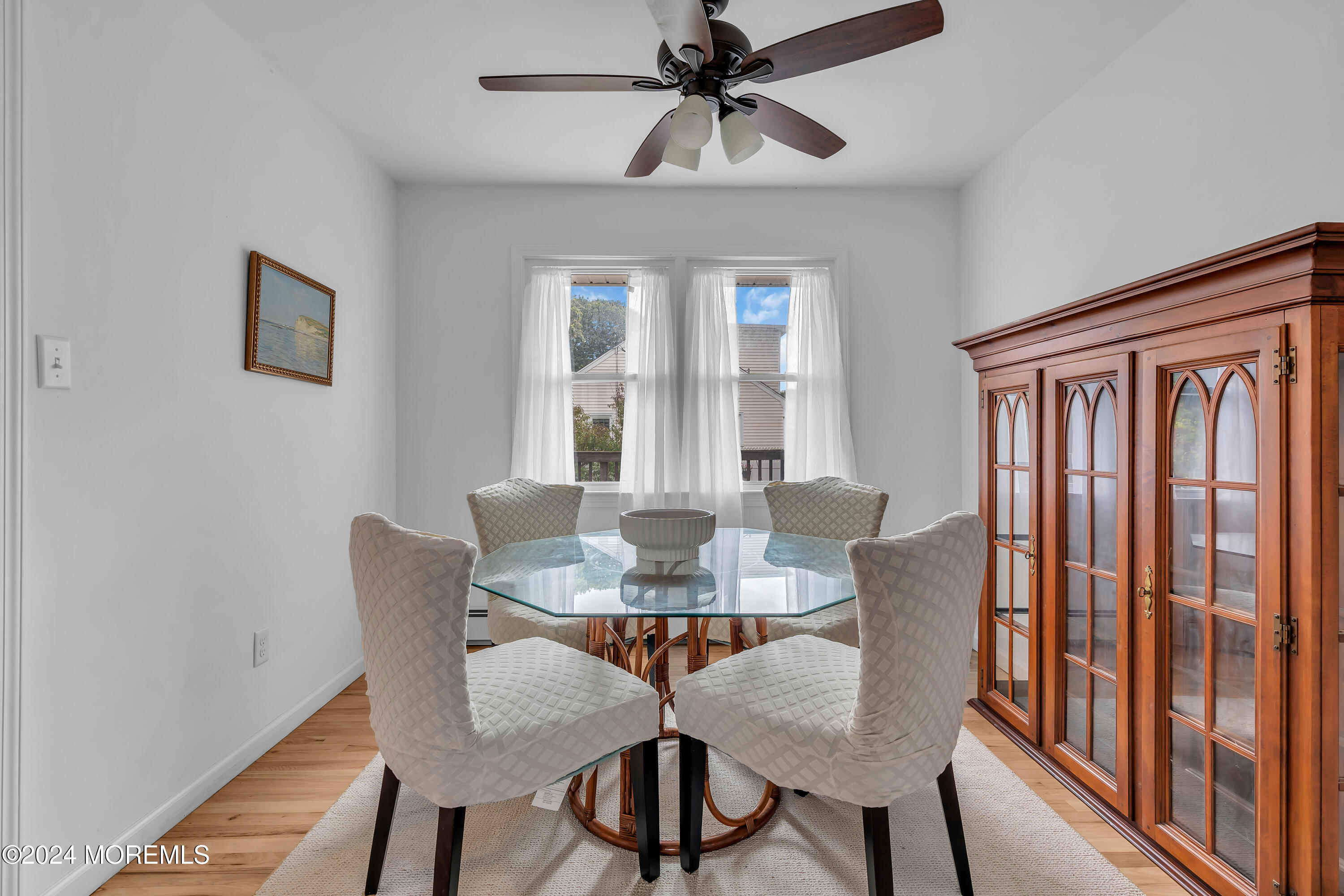 2600 River Road Point Pleasant, NJ 08742 - Photo 19 of 67 a view of a dining room with furniture window and wooden floor