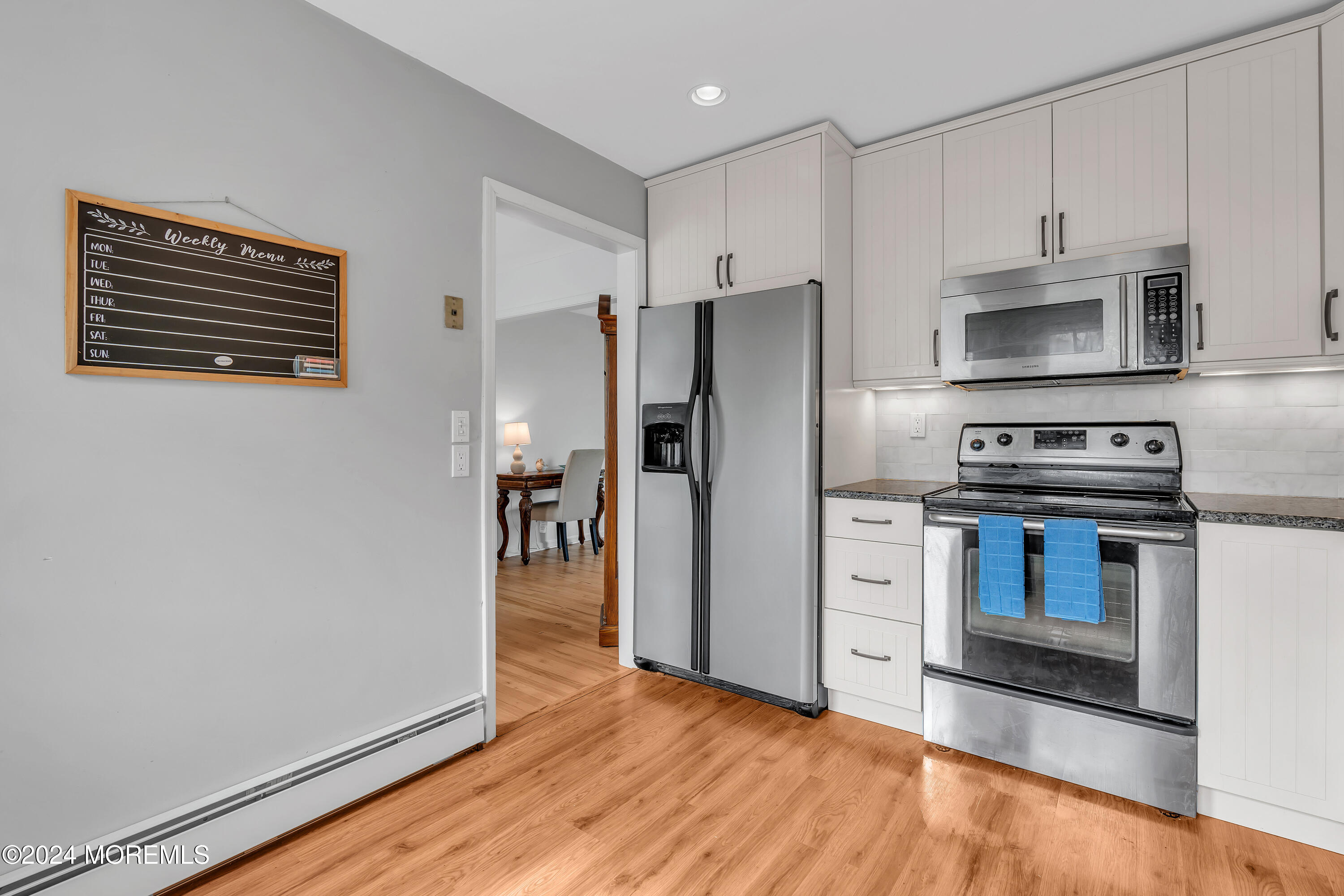 2600 River Road Point Pleasant, NJ 08742 - Photo 24 of 67 a kitchen with stainless steel appliances a refrigerator stove and microwave