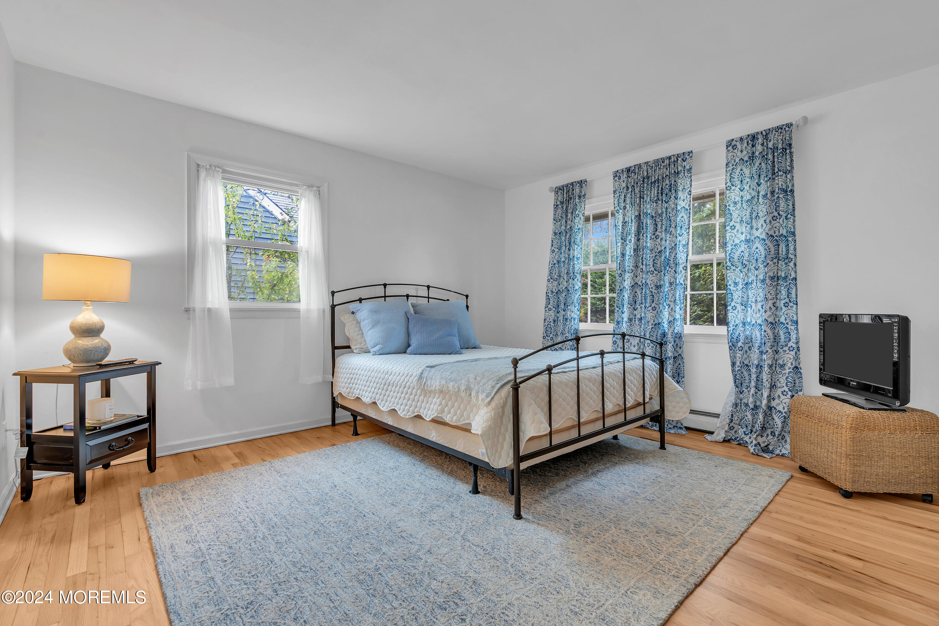 2600 River Road Point Pleasant, NJ 08742 - Photo 26 of 67 a bedroom with a bed and a tv on table