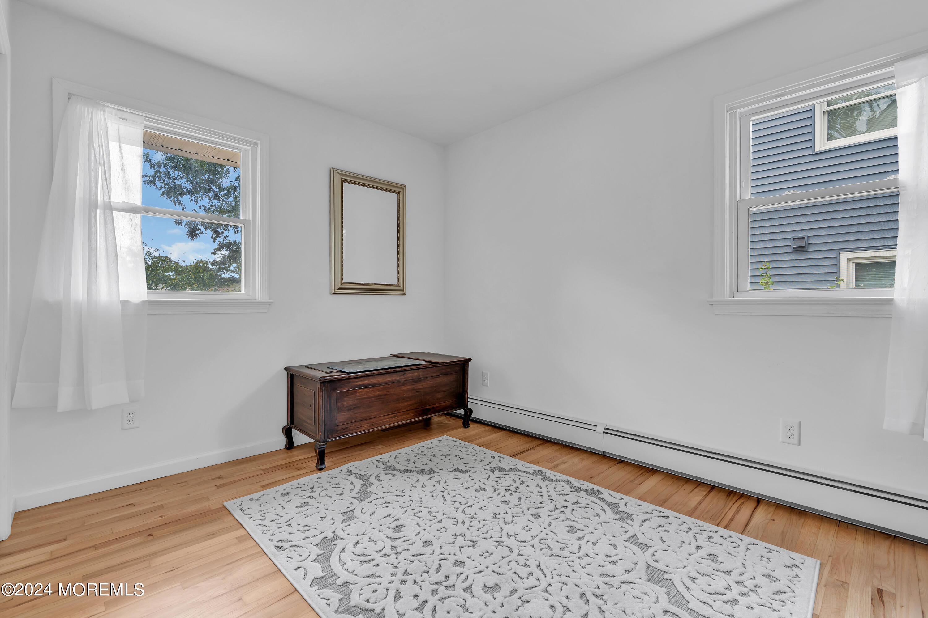 2600 River Road Point Pleasant, NJ 08742 - Photo 29 of 67 a bench sitting in a bedroom next to a window