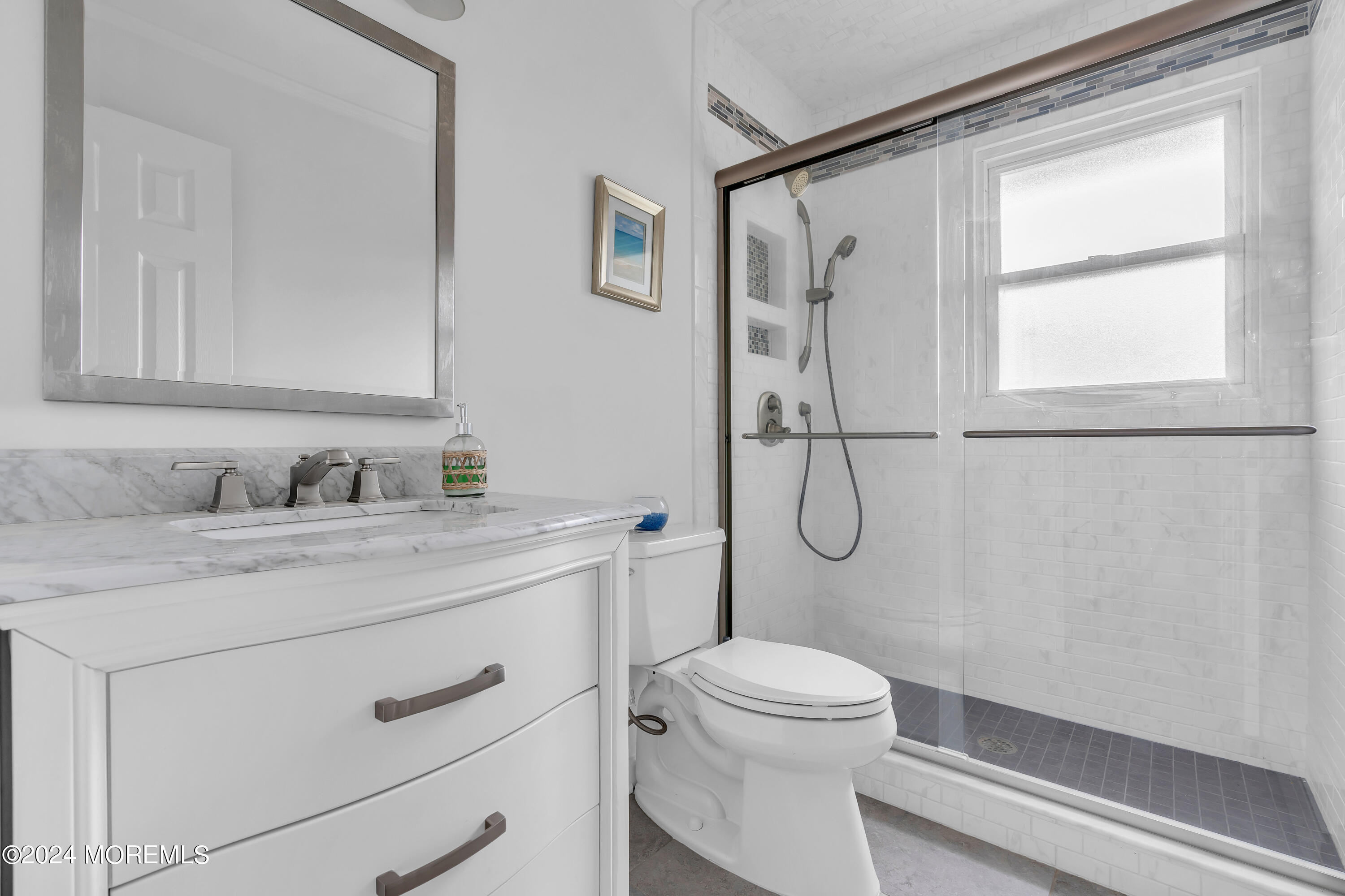 2600 River Road Point Pleasant, NJ 08742 - Photo 30 of 67 a bathroom with a granite countertop sink toilet and shower