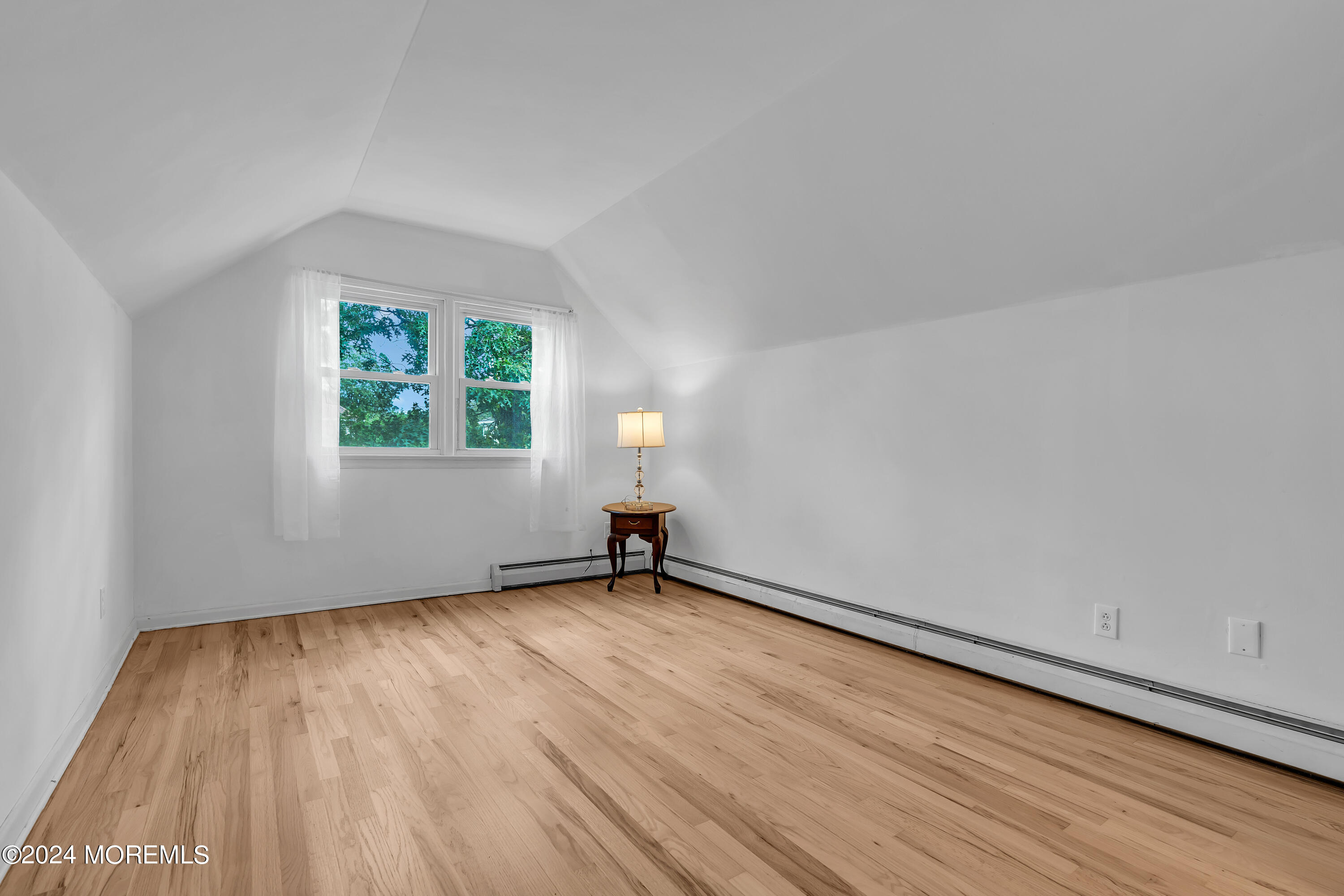 2600 River Road Point Pleasant, NJ 08742 - Photo 34 of 67 an empty room with wooden floor and windows