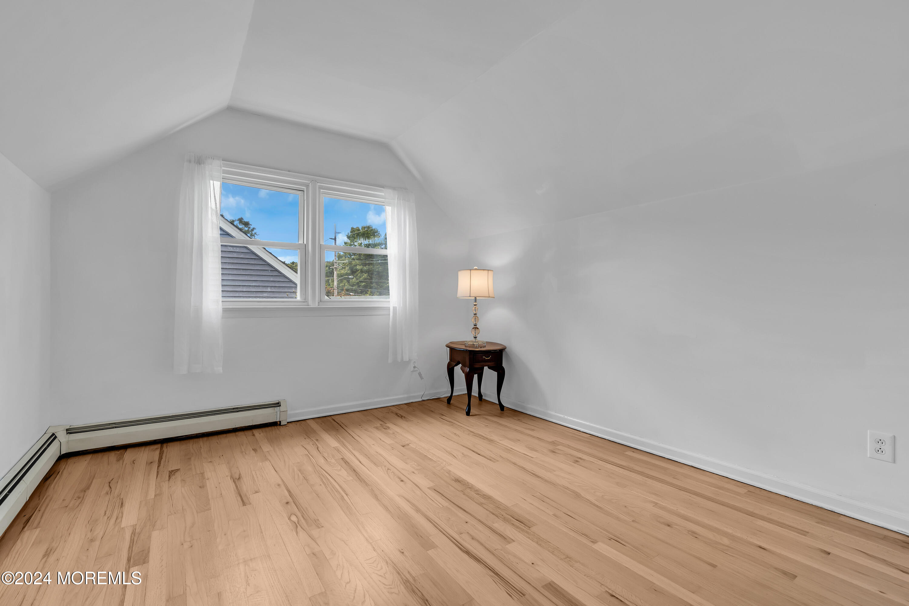 2600 River Road Point Pleasant, NJ 08742 - Photo 35 of 67 a view of an empty room with wooden floor and a window